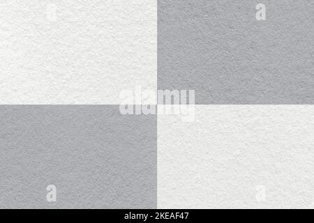 Texture of craft white and gray paper background with cells pattern, macro. Structure of vintage dense kraft grey cardboard. Felt abstract checkered b Stock Photo
