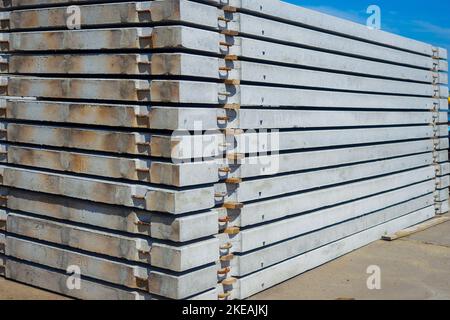 Concrete slabs stacked. Material for construction. Background for supplier. Reinforced concrete floors.. Stock Photo