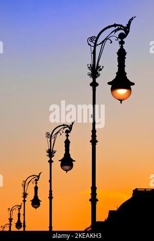 Old Berlin gas lanterns in the street Unter den Linden at sunset at the German Historical Museum, Germany, Berlin Stock Photo