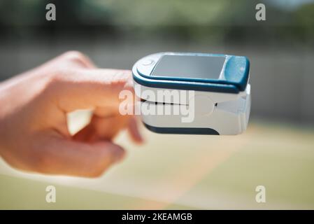 Hand, health and pulse oximeter in nature for oxygen measurement. Healthcare, wellness or SPO2 meter on finger of person to check, monitor or test Stock Photo