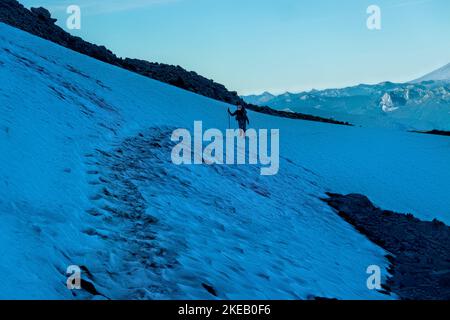Crossing a snowfield in the Goat Rocks Wilderness, Pacific Crest Trail, Washington, USA Stock Photo