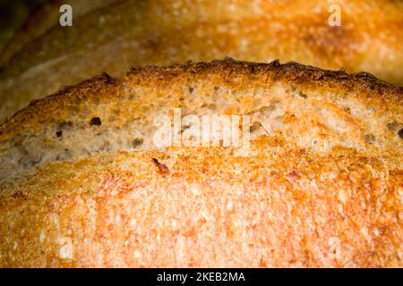Fresh sourdough bread with crunchy crust and soft and savory inside. Close up shot of homemade bread. Stock Photo