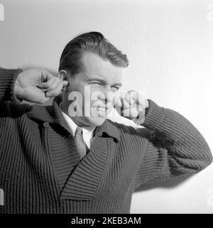 Voices in his head. Young man suffering from the colleagues' talks in ...