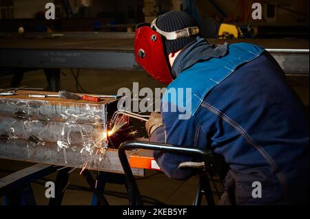 Cutting a steel beam with a gas torch. Industrial metal cutting. The ...