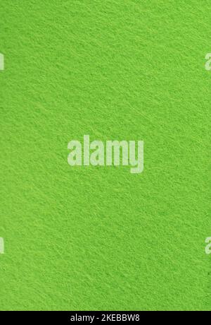 Full frame in short pile green felt, vertical arrangement. Texture and background of felt material. Copy space. Stock Photo