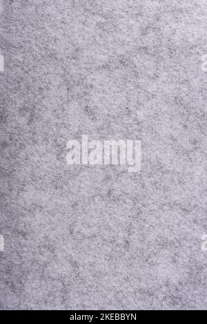 Full frame in short pile gray felt, vertical arrangement. Texture and background of felt material. Stock Photo
