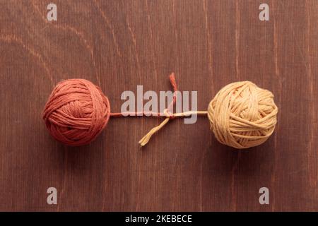 Knot with two balls for Crocheting Handmade and hooks on a Dark Wooden background with a copyspace top view Stock Photo