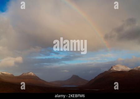 Rainbow over Coigach and Inverpolly mountains, Highland Scotland Stock Photo