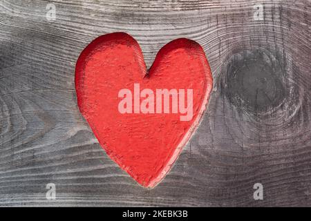 Romantic red heart in a wooden door plate. Romantic background template for wedding, christmas and other lovely occasions. Stock Photo