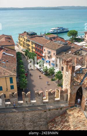 Sirmione Lake Garda, view in summer from Scaligero Castle of the lakefront Piazza Castello in the scenic Lake Garda town of Sirmione, Lombardy, Italy Stock Photo