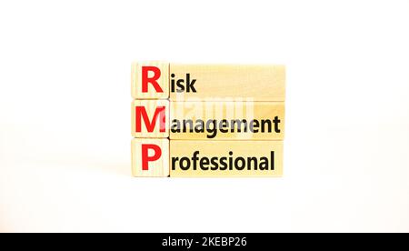 RMP risk management professional symbol. Concept words RMP risk management professional on wooden blocks on a beautiful white background. Business RMP Stock Photo