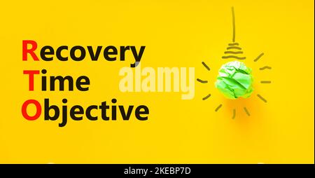 RTO recovery time objective symbol. Concept words RTO recovery time objective on a beautiful yellow background. Light bulb. Business and RTO recovery Stock Photo