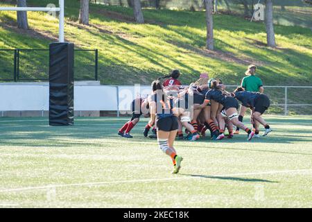 Tense moment of girls rugby fight . Dramatic challenging game for women's rugby team in match day Stock Photo