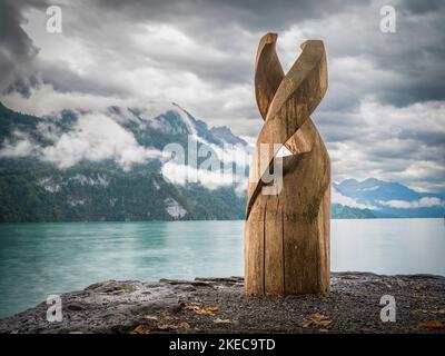 Wooden statue on the lake Brienz Stock Photo