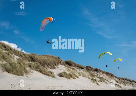 Paraglider over Dunes Stock Photo
