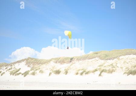 Paraglider over Dunes Stock Photo