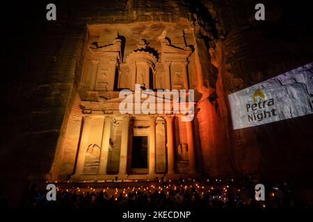 Petra, Jordan - October 27 2022: The Treasury or Al Khazneh Facade in Petra by Night illuminated by Candles Stock Photo