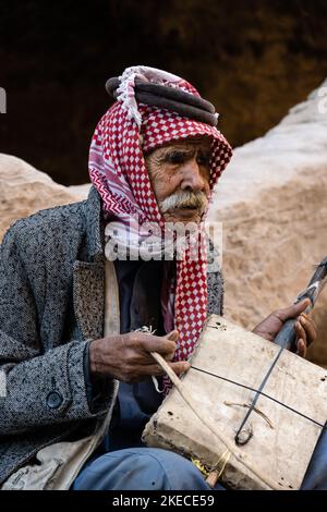 Siq el-Barid, Jordan - October 29 2022: Elderly Jordanian Bedouin Man Playing the Rababah One-String Violin Stock Photo