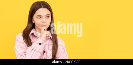 thoughtful look. tween child wear plaid shirt. chequered flannel jacket. beauty and fashion. Child face, horizontal poster, teenager girl isolated Stock Photo