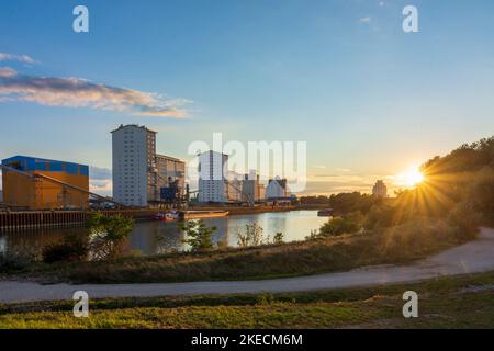 Vienna, port Alberner Hafen, cargo ship, warehouses, sunset in 11. Simmering, Wien, Austria Stock Photo