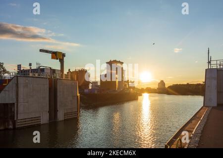 Vienna, port Alberner Hafen, cargo ship, warehouses, sunset in 11. Simmering, Wien, Austria Stock Photo