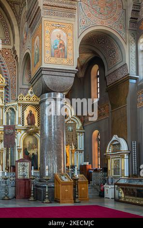 Helsinki, Finland - July 20, 2022: Uspenski Cathedral. Variation of church furniture under massive painted and decorated ceiling and wall supported by Stock Photo