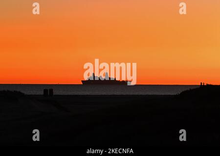 United States Navy LPD off the coast of Coronado, California at sunset Stock Photo