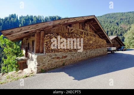 Mountain farm on the edge of steep slope in South Tyrolean Ulten Valley Stock Photo