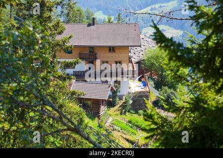 new mountain farmhouse built on a steep slope in the South Tyrolean Ulten Valley Stock Photo