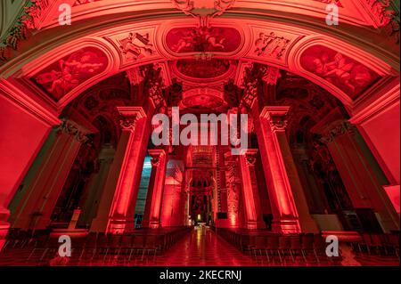 Passau, Germany. 11th Nov, 2022. The interior of St. Stephen's Cathedral is illuminated in red. In solidarity with persecuted Christians, the cathedral glows blood red. The initiator of the annual campaign is the Catholic relief organization Kirche in Not. Around Red Wednesday, this year November 23, numerous churches, monasteries, monuments and public buildings around the globe are illuminated or lit up in blood red. Credit: Armin Weigel/dpa/Alamy Live News Stock Photo