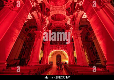 Passau, Germany. 11th Nov, 2022. The interior of St. Stephen's Cathedral is illuminated in red. In solidarity with persecuted Christians, the cathedral glows blood red. The initiator of the annual campaign is the Catholic relief organization Kirche in Not. Around Red Wednesday, this year November 23, numerous churches, monasteries, monuments and public buildings around the globe are illuminated or lit up in blood red. Credit: Armin Weigel/dpa/Alamy Live News Stock Photo