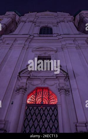 Passau, Germany. 11th Nov, 2022. Red light shines from a window at St. Stephen's Cathedral. In solidarity with persecuted Christians, the interior of the cathedral glows blood red. The initiator of the annual campaign is the Catholic relief organization Kirche in Not. Around Red Wednesday, this year November 23, numerous churches, monasteries, monuments and public buildings around the globe are illuminated or lit up blood red. Credit: Armin Weigel/dpa/Alamy Live News Stock Photo