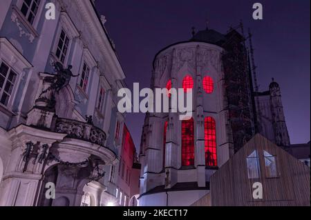 Passau, Germany. 11th Nov, 2022. Red light shines from windows at St. Stephen's Cathedral. In solidarity with persecuted Christians, the interior of the cathedral glows blood red. The initiator of the annual campaign is the Catholic relief organization Kirche in Not. Around Red Wednesday, this year November 23, numerous churches, monasteries, monuments and public buildings around the globe are illuminated or lit up blood red. Credit: Armin Weigel/dpa/Alamy Live News Stock Photo