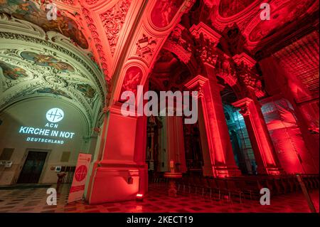 Passau, Germany. 11th Nov, 2022. The interior of St. Stephen's Cathedral is illuminated in red. In solidarity with persecuted Christians, the cathedral glows blood red. The initiator of the annual campaign is the Catholic relief organization Kirche in Not. Around Red Wednesday, this year November 23, numerous churches, monasteries, monuments and public buildings around the globe are illuminated or lit up blood red. Credit: Armin Weigel/dpa/Alamy Live News Stock Photo