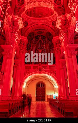 Passau, Germany. 11th Nov, 2022. The interior of St. Stephen's Cathedral is illuminated in red. In solidarity with persecuted Christians, the cathedral glows blood red. The initiator of the annual campaign is the Catholic relief organization Kirche in Not. Around Red Wednesday, this year November 23, numerous churches, monasteries, monuments and public buildings around the globe are illuminated or lit up in blood red. Credit: Armin Weigel/dpa/Alamy Live News Stock Photo