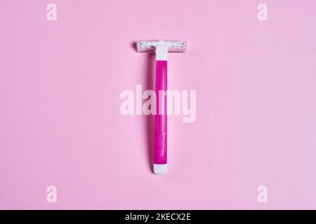 a toothbrush on a pink background with copy space in the top right corner, and an image of a toothbrush Stock Photo