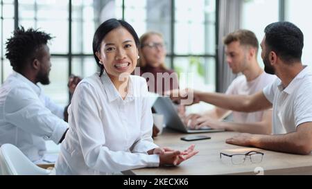 Happy young woman and looking at the camera. Portrait of a smiling businesswoman in the office Stock Photo