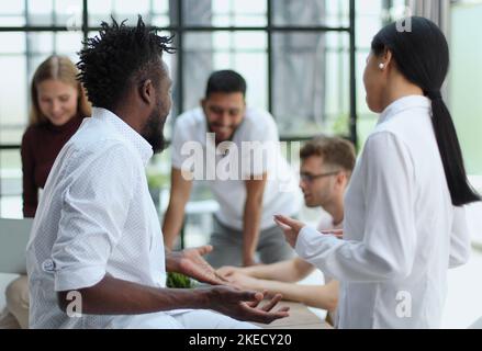 Welcome to our team Shaking hands while working in the creative office Stock Photo