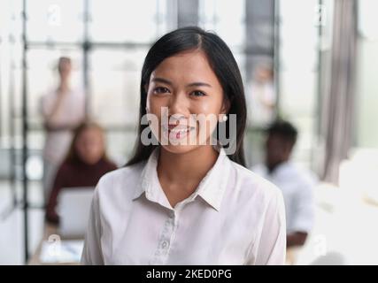 Young beautiful Asian business woman consultant , portrait of an employee looking at the camera Stock Photo
