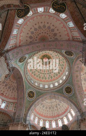 Wide angle view of interior of Yeni Cami or New Mosque in Istanbul. Ramadan or islamic background photo. Istanbul Turkey - 10.27.2022 Stock Photo