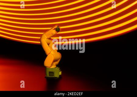 Technical model of a robot with lightpainting in background Stock Photo