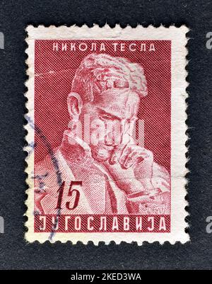 Cancelled postage stamp printed by Yugoslavia, that shows scientist Nikola Tesla, circa 1953. Stock Photo