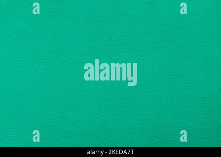 Green plaster wall texture. Painted wall green textured wall. Stock Photo