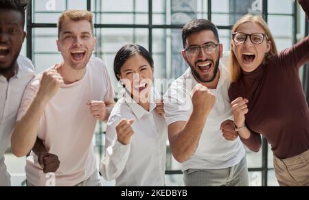 Portrait of successful creative business team looking at camera and smiling. Stock Photo