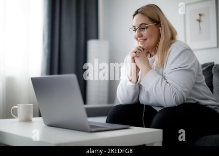 Student with laptop at home Stock Photo