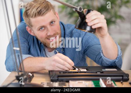 happy and successful young computer engineer Stock Photo