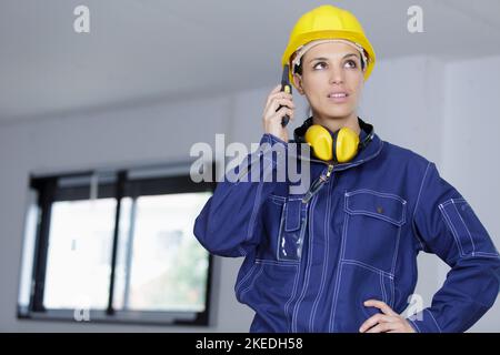 woman builder on the phone Stock Photo