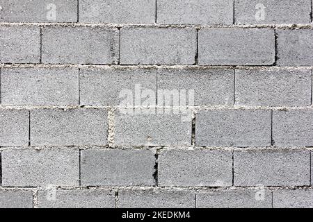 a wall made of concrete bricks – a surface texture Stock Photo