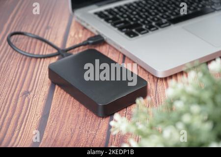 working with External Drive connected with laptop Stock Photo