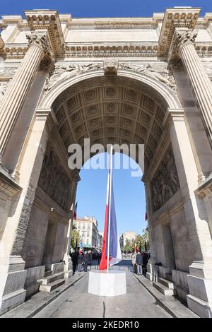 Marseille, France. 11th Nov, 2022. The French flag seen under the Arc de Triomphe monument during the commemoration of the armistice of November 11, 1918. Credit: SOPA Images Limited/Alamy Live News Stock Photo